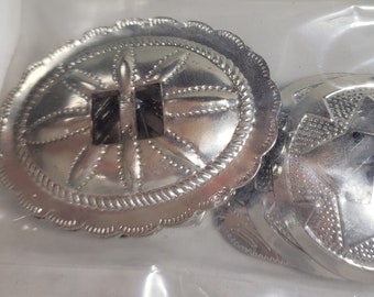 24 piece metal conchos, assorted unopened bag // each piece 1.25 to 2.25 inches wide