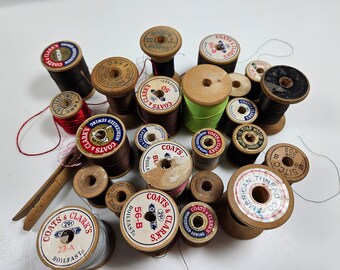 vtg lot 24 wooden thread spools // height range is 1 - 2 inches // various ages, brands, wood color // some with thread