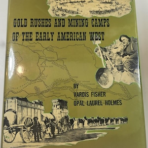 May include: A vintage book cover titled "Gold Rushes and Mining Camps of the Early American West." The cover features illustrations of a map, a miner, and a wagon train. The book is by Vardis Fisher and Opal Laurel Holmes.