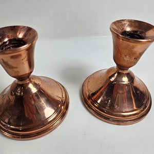 vtg copper candlestick pair for taper candles // each is 3.75&quot; wide x 3.75&quot; tall // tarnished and rustic
