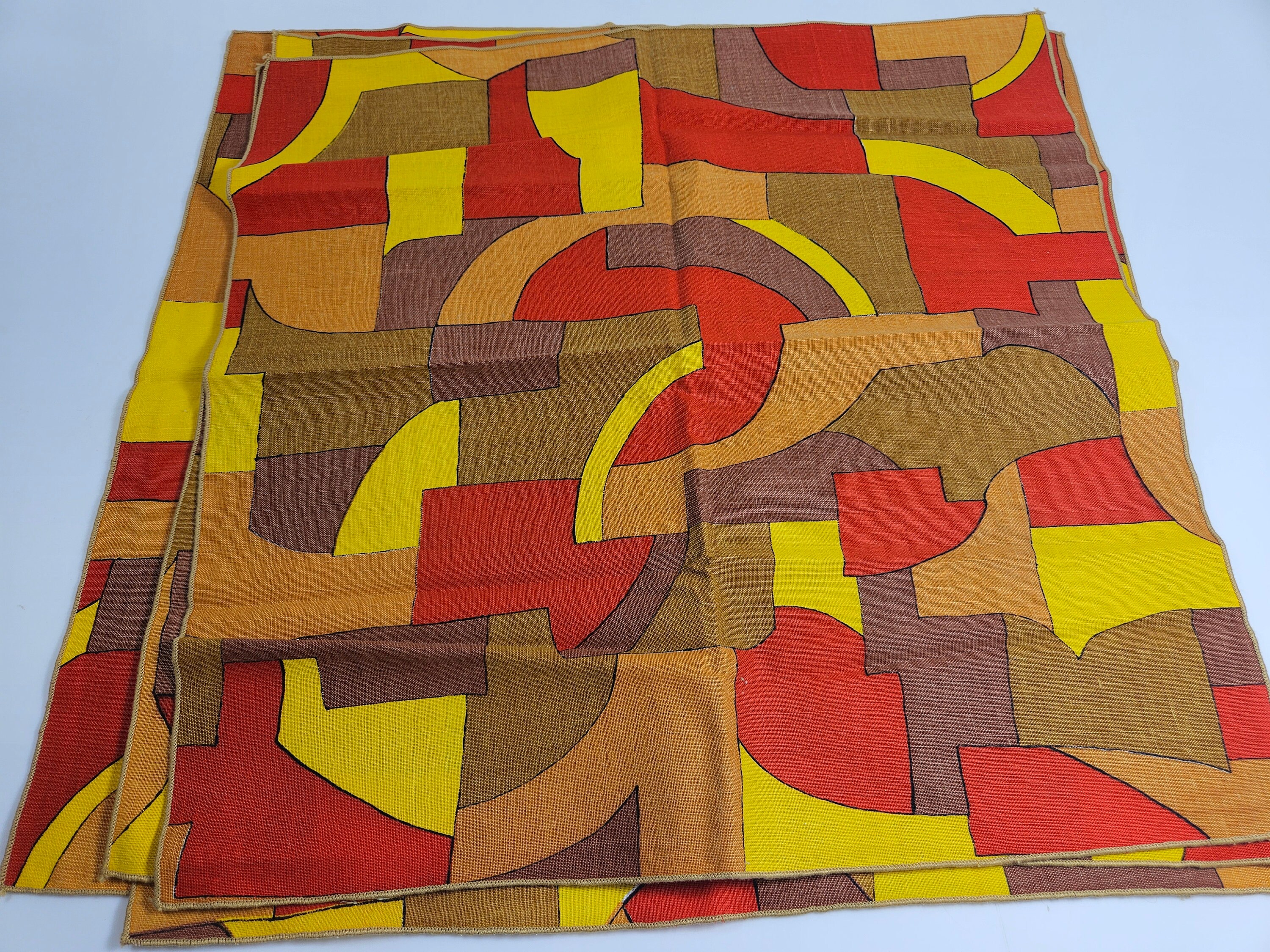 4 vtg bright orange and yellow MCM geometric woven fabric napkins, each 16.5 inches square when unfolded