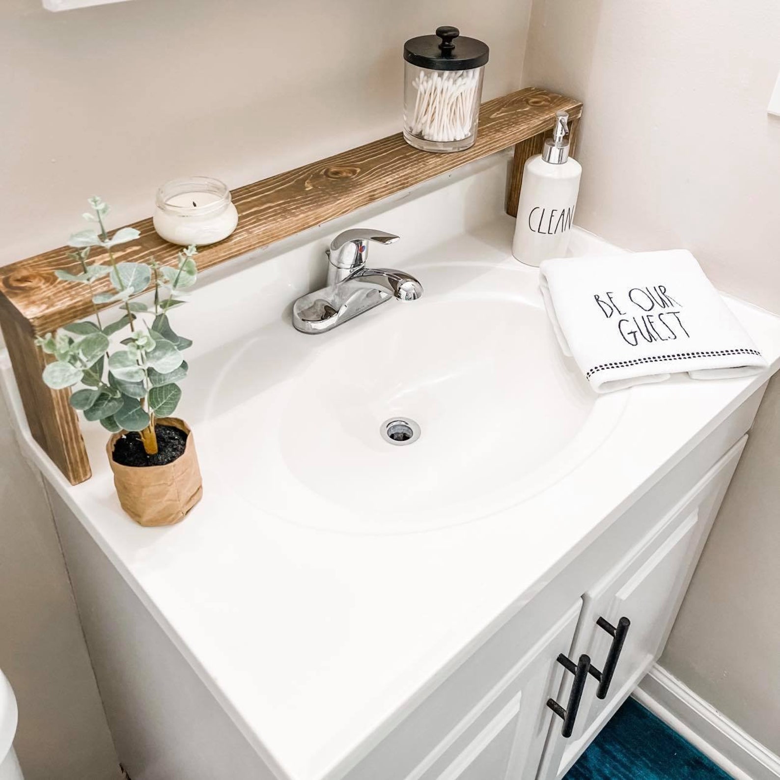 I would LOVE any advice on how to organize our bathroom sink area!! So  embarrassing…our sink area has no wall space but we have all this countertop  between two sinks so shit