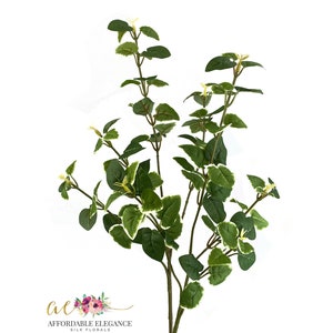 May include: A single artificial floral stem with green leaves edged in white. The stem is brown and has multiple branches with leaves. The logo "Affordable Elegance Silk Florals" is in the lower left corner.
