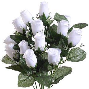 May include: A bouquet of 12 white artificial rose buds with green leaves and small white flowers.