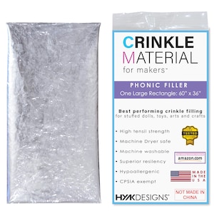 May include: A package of silver crinkle material for stuffing toys, dolls, and crafts. The package includes a large rectangle of crinkle material measuring 60 inches by 36 inches. The package also includes a label with the text "Crinkle Material for Makers - Phonic Filler" and a list of features, including "High Tensile Strength", "Machine Dryer Safe", "Machine Washable", "Superior Resiliency", "Hypoallergenic", and "CPSIA Exempt".
