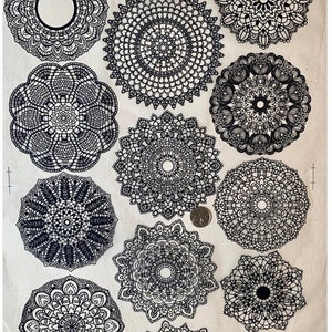 May include: A collection of 12 black and white doily designs. The doilies are intricate and detailed, with a variety of patterns. The doilies are arranged in a circular pattern on a white background.