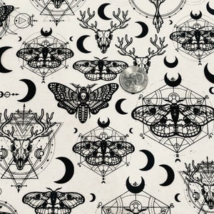 May include: Black and white patterned fabric featuring repeating images of moths, crescent moons, deer skulls, and geometric shapes.