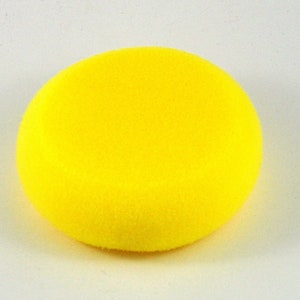 May include: A bright yellow sponge circle, ideal for cleaning and polishing.