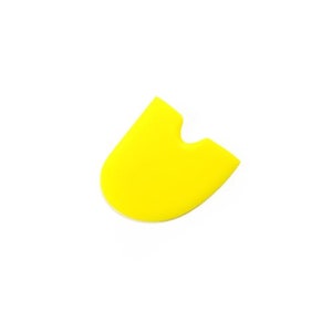 May include: A bright yellow silicone spatula with a rounded shape and a small notch at the top.