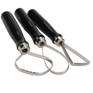 May include: Three pottery tools with black handles, each featuring a metal loop and serrated edge. These tools are used for shaping and smoothing clay.