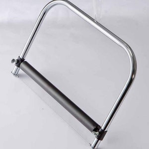 May include: A chrome-plated cheese wire cutter with a black-coated wire and adjustable tension knobs.