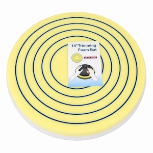 May include: A round, yellow foam bat with concentric blue circular grooves on its surface. A rectangular instruction card is placed on top, featuring the text 14" Trimming Foam Bat and an illustration of the product used for car buffing.