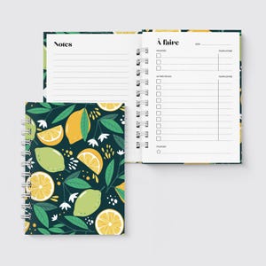 May include: Spiral-bound notebook with a dark teal cover featuring a pattern of lemons, limes, and leaves. The open pages display lined notes and a to-do list. The notebook is designed for taking notes and organizing tasks.
