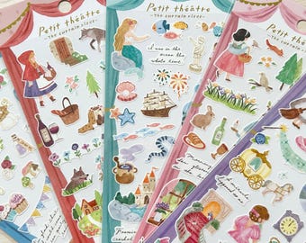May include: Five sticker sheets with a theatrical theme, each featuring a different color scheme and illustrations. The stickers depict various fairytale characters and objects, including a mermaid, a wolf, and a pumpkin. The text "Petit théâtre" is printed on each sheet.