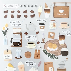 Puede incluir: Una hoja de pegatinas decorativas con temática de café. Las pegatinas incluyen granos de café, tazas, cafeteras y frases como "I like coffee" y "morning coffee". Las pegatinas son de varios colores, incluyendo marrón, blanco y beige.