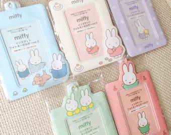 May include: Five Miffy instant photo key holders in light blue, cream, lavender, mint green, and pink. Each rectangular plastic frame features Miffy character illustrations, a top hanging loop, and printed Japanese text on the insert.