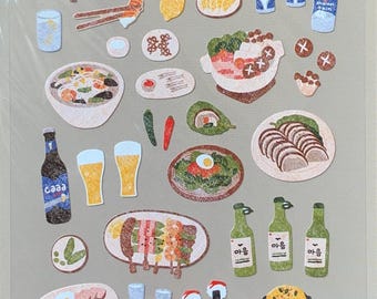 May include: A sheet of Suatelier stickers, no.1109, with food-themed illustrations. The stickers depict various dishes, drinks, and bottles. The colorful, hand-drawn style is suitable for scrapbooking or decoration.