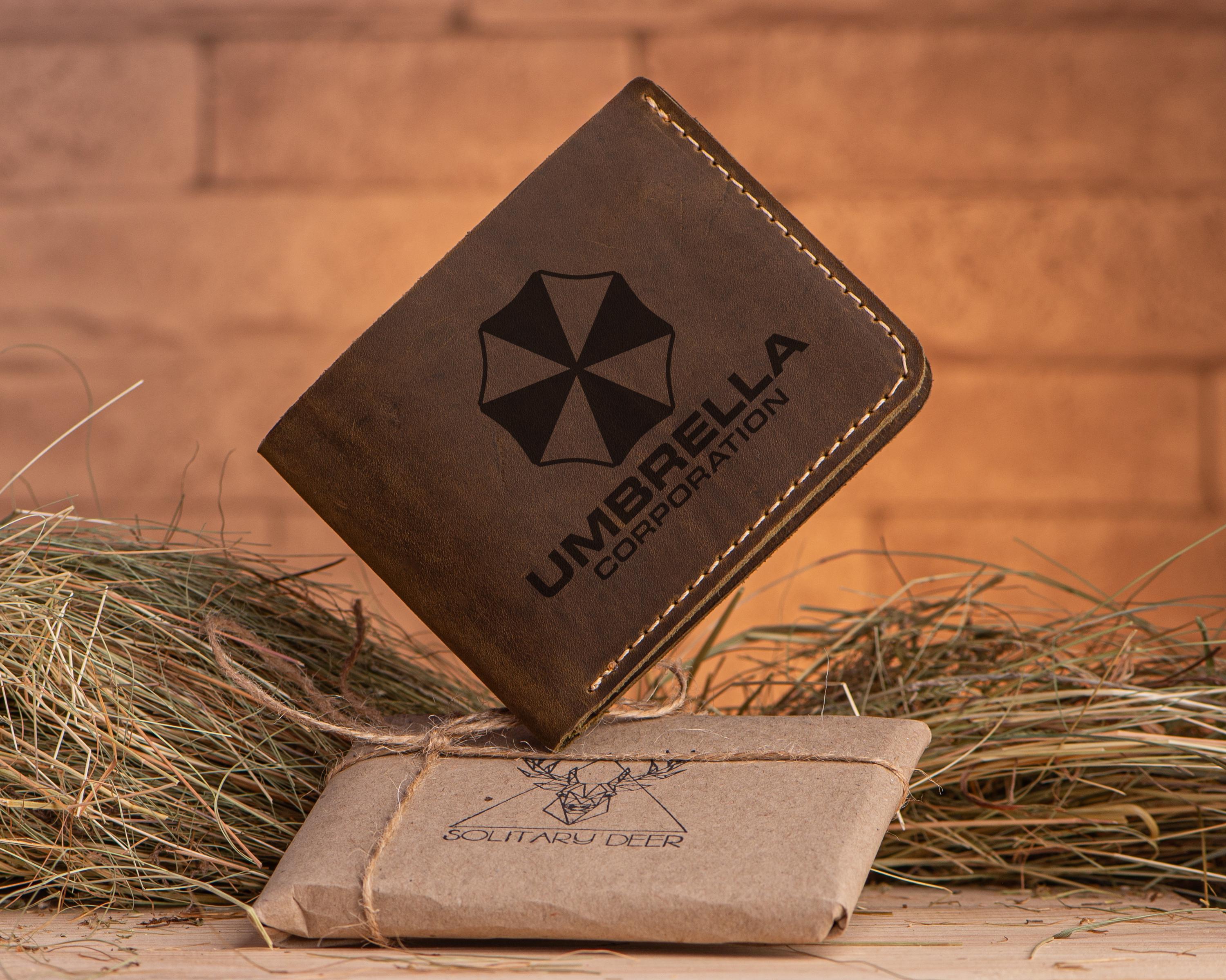 UMBRELLA CORPORATION Resident Evil 4 in. Bi Fold Wallet UMBRELLA CORPORATION Resident Evil 4 in. Bi Fold Wallet