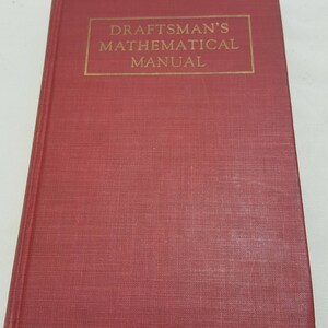 May include: A red hardcover book with the title "DRAFTSMAN'S MATHEMATICAL MANUAL" in gold lettering.