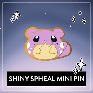 May include: Shiny purple and white Spheal mini pin with a gold outline. The pin is against a purple and blue gradient background with white stars.