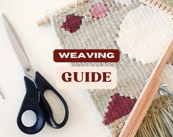 May include: A weaving loom with a partially finished tapestry featuring a geometric pattern with pink, red, and white yarn. The loom is made of wood and has a wooden dowel at the top. A pair of scissors and a needle are also visible in the image. The text "WEAVING GUIDE" is displayed in red letters.