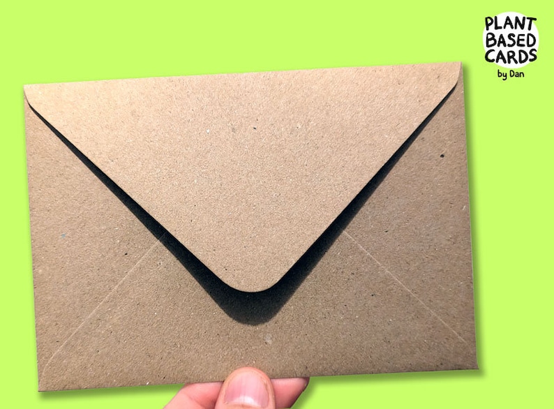 May include: A brown paper envelope with a white flap. The envelope is made of recycled paper and has a textured surface.