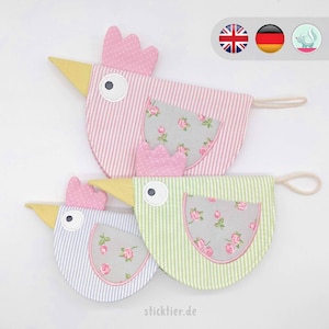 May include: Three fabric Easter chick ornaments with striped bodies and floral accents. The chicks are pink, green, and blue. The largest chick has a yellow beak and a white eye.
