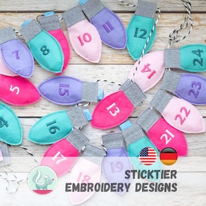 May include: A string of colorful felt Christmas light ornaments, each with a number embroidered on them. The lights are in shades of pink, purple, and teal, with silver-colored bases. The text "STICKTIER EMBROIDERY DESIGNS" is at the bottom.