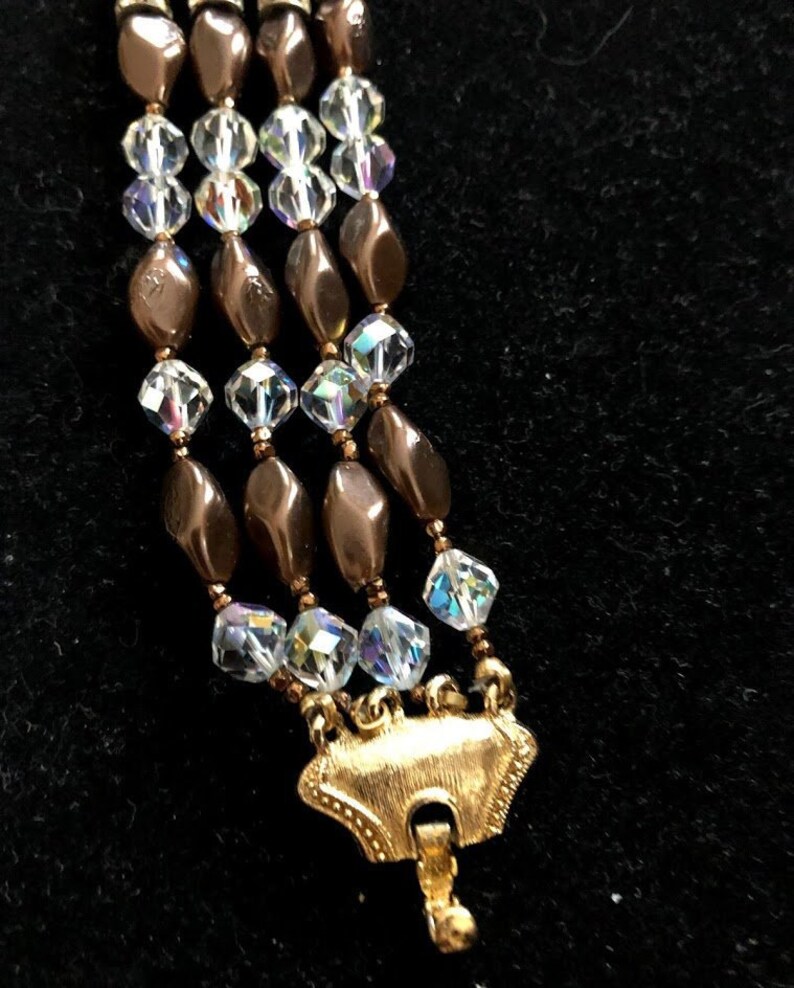 Vintage Coro Bracelet Multi strand Gold tone clasp. Aurora Borealis beaing with bronze bead accent