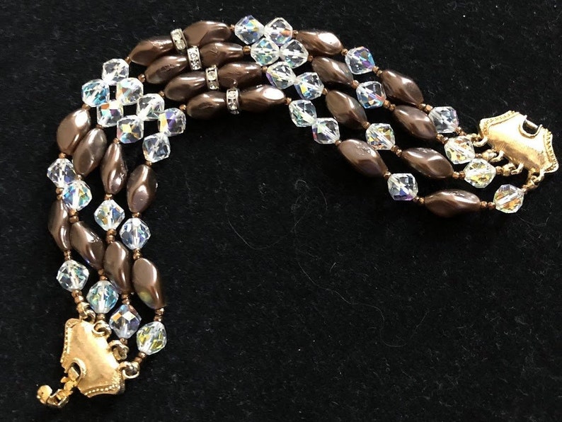 Vintage Coro Bracelet Multi strand Gold tone clasp. Aurora Borealis beaing with bronze bead accent