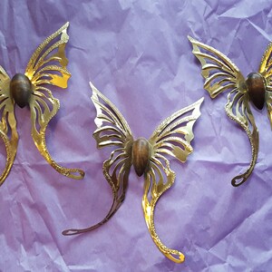 3 - Golden, Glittery, metal butterflies. All about 5 1/2&quot; tall by 5 1/2&quot; wide.