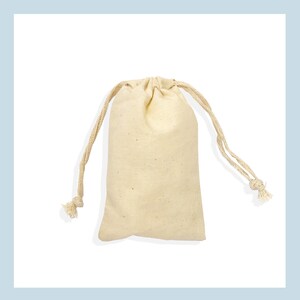 May include: A plain white cotton drawstring bag with a natural cotton cord.