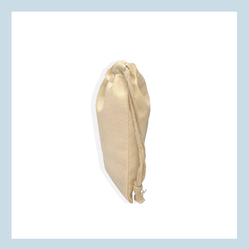 May include: A plain white cotton drawstring bag with a white cotton drawstring.
