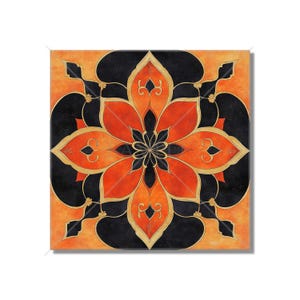 May include: A square canvas print with a geometric design in shades of orange, red, and black. The design features a central flower with intricate details and a repeating pattern of curved lines.