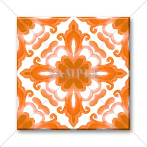 May include: A square tile with an orange and white geometric pattern. The pattern is symmetrical and features a central flower-like design.