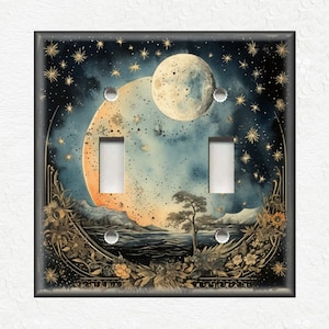 May include: A light switch cover with a watercolor illustration of a crescent moon, stars, and a landscape with a lake and a tree. The background is a dark blue with gold accents.