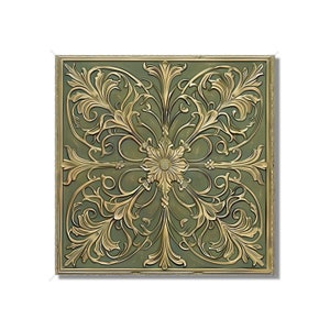 May include: A square decorative wall tile with a gold-colored, ornate design on a green background. The design features intricate floral patterns and swirls.
