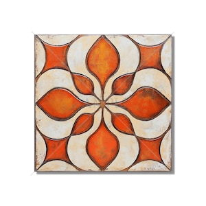 May include: A square ceramic tile with a geometric pattern of orange and white. The pattern is a stylized flower with eight petals.