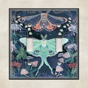 May include: A light switch cover with a dark blue background featuring a green and white luna moth and a purple and orange moth with floral details.