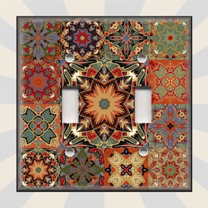 May include: A light switch cover with a colorful geometric pattern. The pattern is made up of various shades of red, orange, yellow, green, blue, and purple. The switch cover is made of durable plastic and is easy to install.