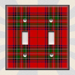 May include: A red, green, and black plaid light switch cover with two toggle switches.
