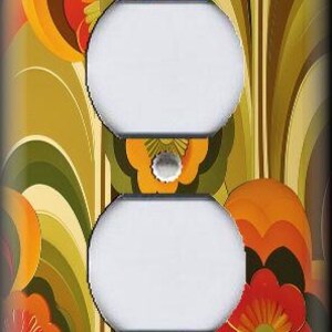 May include: A decorative wall outlet cover featuring a retro floral design. The cover has two white outlet openings and is adorned with orange, red, and yellow flowers against a green and brown background. The design evokes a vintage, 1970s aesthetic.