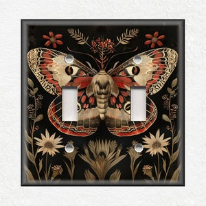 May include: A light switch cover featuring a detailed illustration of a red, black, and white butterfly with floral accents on a black background.