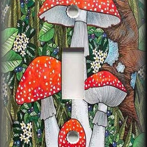 May include: A light switch cover featuring a whimsical illustration of red and white mushrooms with white spots growing in a green forest setting.