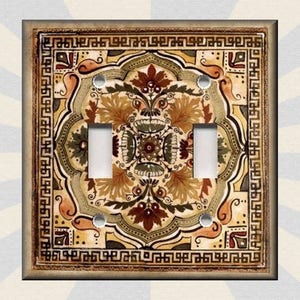 May include: A decorative light switch cover with a vintage floral pattern in shades of brown, beige, and red. The pattern is surrounded by a gold border with a geometric design.