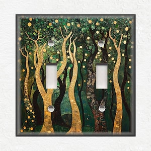 May include: A double light switch cover featuring a stylized painting of a forest with gold and green trees. The trees are painted in a stylized, almost abstract way, with gold accents on the trunks and branches.