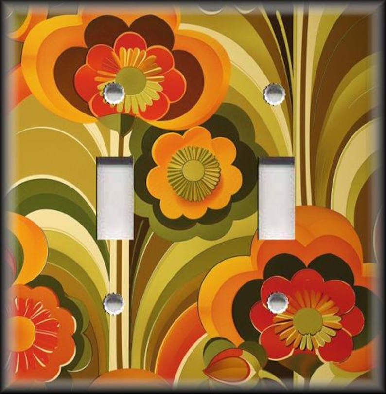 May include: A decorative light switch cover featuring a retro floral design. The cover has a vibrant pattern of orange, red, brown, and green flowers and leaves. The cover has two light switch openings and silver screws.