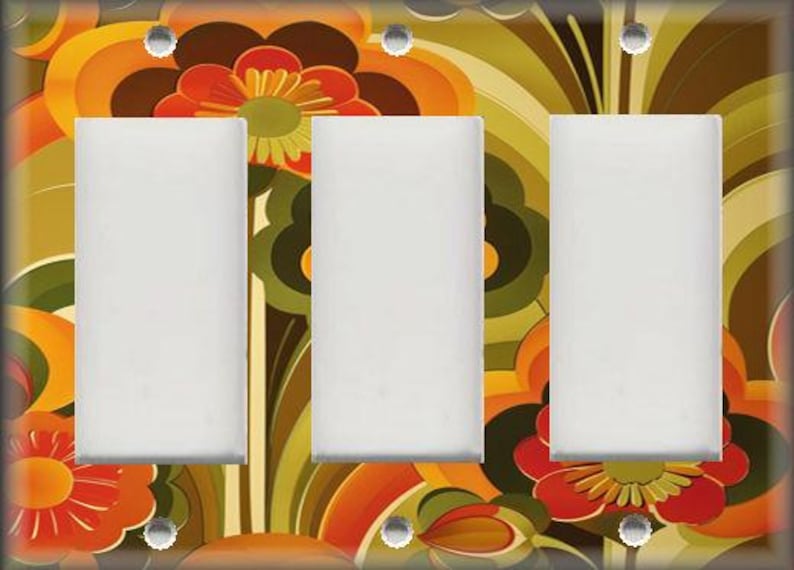 May include: A decorative triple light switch cover with a retro floral design. The cover features a vibrant pattern of orange, red, brown, and green flowers and abstract shapes. The three switch openings are white, and the screws are silver.