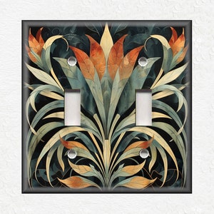 May include: A double light switch cover with a decorative design featuring stylized floral motifs in shades of teal, orange, and yellow on a black background.