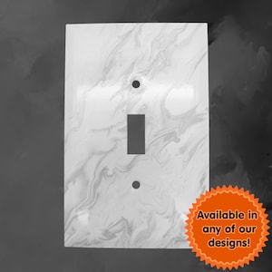 May include: White light switch cover with a marbled design. Available in any of our designs!